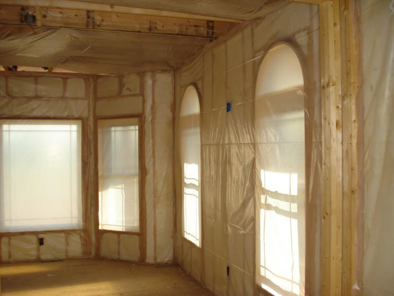 Open Cell Spray Foam Insulation on interior walls over arched bay window